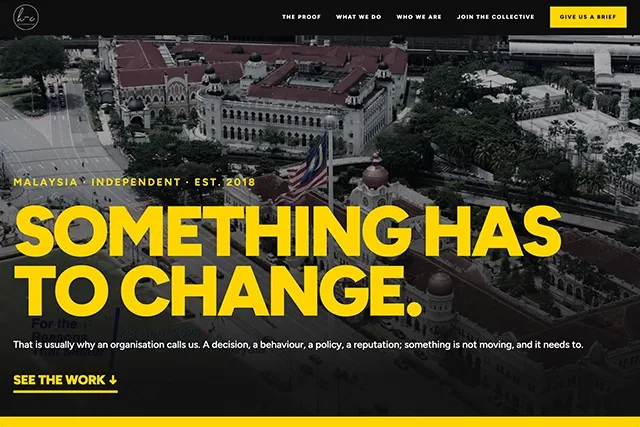 The Hexa-Communications homepage, with the headline "Something has to change." in yellow over an aerial photograph of Kuala Lumpur.
